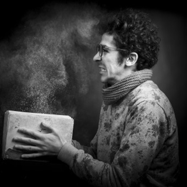 A man slamming a book closed